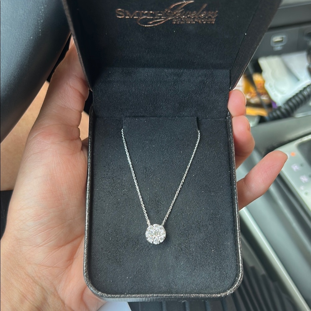 Diamond necklace featuring white gold.